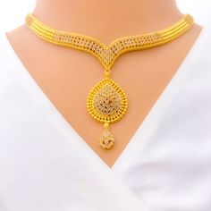 This Graceful Drop 22k Gold Kundan Necklace Set, weighing 51.8 grams, is a stunning fusion of traditional craftsmanship and elegance. Adorned with exquisite Kundan stones, it features a luxurious yellow gold finish. The set has a necklace length of 16 inches, with a drop length of 1.75 inches, and 1.7-inch adjustable links for a customizable fit. A secure hook lock ensures comfortable wear. Matching earrings, each 1.75 inches in length with screw-back posts, complete the set. Ideal for those who Gold Kundan Necklace, Kundan Necklace Set, Kundan Necklace, Kundan Necklaces, 22k Gold, Necklace Length, Matching Earrings, Gold Finish, Necklace Set