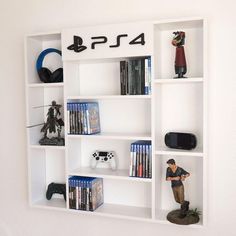 a video game shelf with various games and figurines on it, along with the playstation 4