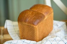 a loaf of bread sitting on top of a bed