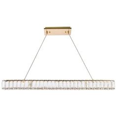 a rectangular chandelier hanging from the ceiling with clear glass rods and brass fixtures