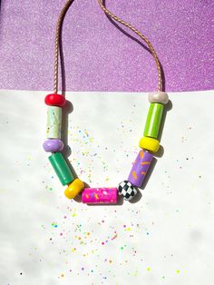 ✿ Bold & unique wearable art Utopic Color Charm Necklace ✿ Made with various shaping techniques ✿ Multicolored & textured handcrafted beads ✿ One of a kind design. Each necklace is distinct from the next ✿ Extremely durable leather cord ✿ Worldwide international shipping Whether you're planning to go to a concert, a festival, a birthday party, a night out with friends, the beach, or the supermarket, delicately handcrafted Utopic Color Charm Necklace adds a unique touch to your outfit! Handmade Retro Necklaces For Festival, Retro Handmade Necklaces For Festival, Handmade Retro Necklace For Festivals, Handmade Retro Necklace For Festival, Retro Handmade Necklace For Festival, Artistic Handmade Beaded Necklaces For Festivals, Artsy Handmade Beaded Necklaces For Festivals, Handmade Artsy Beaded Necklace For Festivals, Artistic Handmade Beaded Necklace For Festival