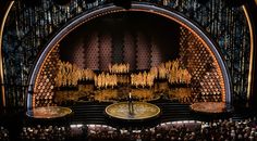 the stage at the oscars is set for an award ceremony in front of a large crowd