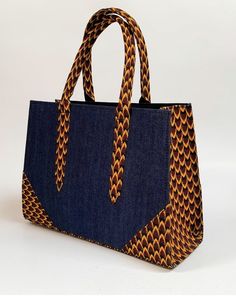 African print handbag Statement handbag with Jean Hand-crafted using African print fabric Size: 14 by 10 by 4.5 African Fabric Accessories, Modern Handbag, Handmade Fabric Bags, African Bag, Statement Handbag, African Crafts, Hand Bags For Women, African Accessories