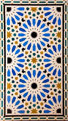 an intricately designed tile with blue and yellow colors on the outside, is shown