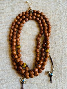 Wonderful used and very good quality Bodhi seeds prayer beads is from Namo Buddha, Nepal. This prayer beads has lots of blessings from many temples and lamas. Counted lots of mantras on this mala. Very nice and smooth. 27 inches long Bodhi mala is perfect for all mantras. With counter, agate Dzi guru beads and extra decoration beads makes Mala more beautiful. Spiritual Wooden Beads Jewelry For Meditation, Holistic Necklaces With 8mm Beads For Rituals, Spiritual Wooden Beads Jewelry For Blessing, Spiritual Jewelry With Wooden Beads For Blessing, Spiritual Necklaces With 108 Beads For Rituals, Spiritual Wooden Beads Mala For Meditation, Spiritual Wooden Beads Necklace For Meditation, Spiritual Hand-strung Beaded Necklaces For Rituals, Holistic Hand-strung Mala For Meditation