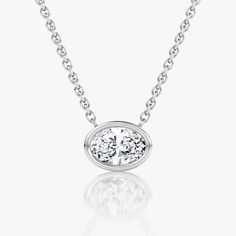 The Bezel Solitaire Necklace combines vintage-inspired detail and modern appeal together for a look that’s timelessly elegant. Jewellery Showroom, Solitaire Necklace, Bespoke Rings, Oval Necklace, Solitaire Necklaces, Three Stone, Necklace Designs, Oval Cut, Diamond Shapes