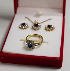 "Beautiful birthstone heart 3-piece set in gift box September/simulated sapphire Set included 16\" gold plated Chain with 3\" adjuster pendant around 3/4\" long round post earrings 1/2\" in diameter ring size 6 adjustable red velvet gift box Great condition" Opal Jewelry Set, Avon Rings, September Sapphire, Yellow Gold Cocktail Ring, Gold Cocktail Ring, Avon Jewelry, Silver Jewellery Sets, Rhinestone Ring, Jewelry Tree