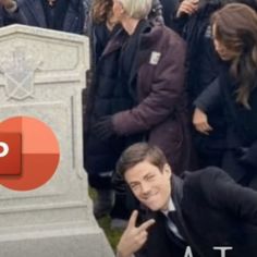 a group of people standing around a grave