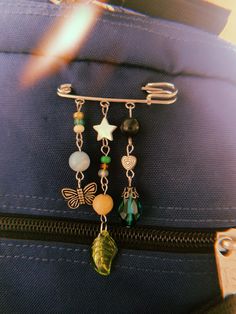 a piece of luggage with charms attached to it