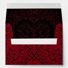 a red and black envelope with an intricate design