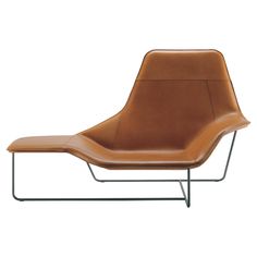 a brown leather lounge chair with metal frame and footrests on an isolated white background