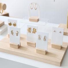 several pairs of earrings are displayed on display