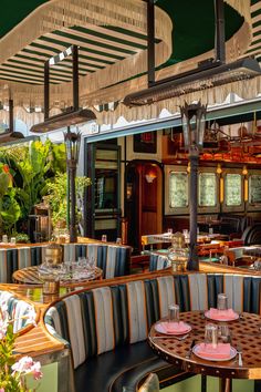 the inside of a restaurant with tables and chairs