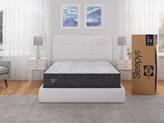 the sealy posture mattress is in front of a bed with a box on it