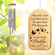 a wooden wind chime with a poem on it and butterflies hanging from the side