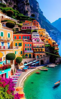 the colorful houses are on the cliff above the water and boats are in the water