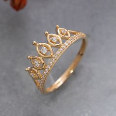 a gold ring with diamonds on it