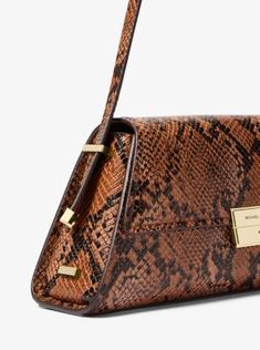 For instant sophistication, look to the Ludlow. This structured shoulder bag is crafted from snakeskin-embossed leather with clean lines and just enough hardware for a touch of shine. Carry it alongside day and evening looks alike. Luxury Leather Shoulder Bag With Snake Print, Luxury Leather Snake Print Shoulder Bag, Elegant Leather Bag With Snake Print, Elegant Leather Snake Print Bags, Elegant Snake Print Leather Bags, Luxury Evening Bag With Snake Print, Luxury Snake Print Evening Bag, Luxury Snake Print Shoulder Bag For Evening, Elegant Snake Print Shoulder Bag