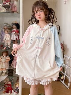 This jacket is crafted from pure cotton fabric, featuring an original design with unique prints and contrasting traditional Chinese frog button closures. Its loose fit is both flattering and stylish. The jacket also comes with convenient pockets on both sides, adding practicality to its charm. To top it off, the hood is adorned with soft and adorable bear ears, making it irresistibly cute when worn.  The price includes one jacket only.   	 		 			Size 			Free Size 		 		 			Bust 			140 		 		 			Le Spring Cotton Kawaii Hoodie, White Kawaii Hoodie Outerwear, Spring Harajuku Cotton Hoodie, Cute White Hooded Jacket With Long Sleeves, Cute White Long Sleeve Hooded Jacket, Harajuku Style Cotton Outerwear With Pockets, White Harajuku Hooded Outerwear, White Hooded Harajuku Style Outerwear, Cute Long Sleeve Outerwear With Drawstring Hood