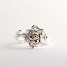 Sterling Silver Rose Ring, Handmade Silver Ring, Women Flower Ring This beautiful, delicate open rose ring would make a stunning statement piece. The band resembles the delicate stem of the rose and every ring is individually handmade so that no two pieces are exactly the same! This makes a truly special gift for yourself or a loved one. * Ring band Material: Sterling Silver * Size of Rose: Approx 1.5 cm (0.59in) diameter 0.6 cm (0.23 in) height * Ready to Ship in 2-4 business day * Made in the Elegant Sterling Silver Rose Design Flower Ring, Delicate Rose Colored Rings For Gift, Delicate Rose Color Rings For Gifts, Delicate Rose Design Rose Colored Ring, Elegant Adjustable Flower Ring With Roses, Elegant Rose Sterling Silver Flower Ring, Elegant Adjustable Rose Flower Ring, Elegant Rose Flower Ring In Sterling Silver, Elegant Flower Ring With Roses For Gift