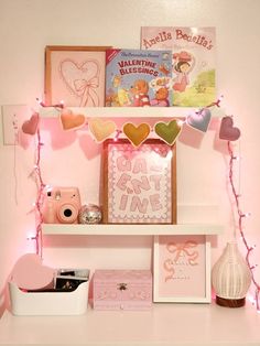 a shelf filled with lots of valentine's day decorations