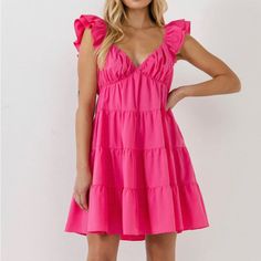 Fuchsia/ Hot Pink Color This Romantic Mini Dress From Endless Rose Can Be Styled For Both Casual And Special Occasions. The Ruffle Sleeves, Tiered Design, And Flowy Silhouette Create A Whimsical Piece. The Lining Makes This Dress Comfortable To Wear All Day, Or Night, Long, While The Side Zipper Makes Changing A Breeze. Layered Ruffle Cap Sleeves Elastic At Shoulders V-Neck Tiered Design Lined Mini Length Flowy Silhouette Concealed Side Zipper With Hook-And-Eye Closure Hand Wash Cold Do Not Blea Jumpsuit Fall, Tiered Mini Dress, Tweed Dress, Rose Dress, Heat Styling Products, Tops Fall, Romper With Skirt, Dress Cuts, Dress First