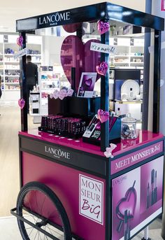 a pink and black cart in a store