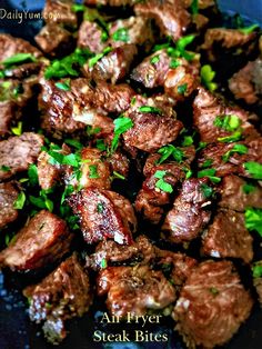 steak bites with parsley on top in a skillet, ready to be eaten