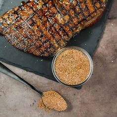 grilled steak and seasoning on a slate platter