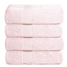 four pink towels stacked on top of each other in front of a white background,