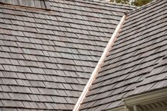 the roof of a house that has been gutted with shingles and is being cleaned