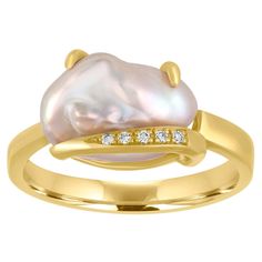 The ring is 18K Yellow Gold There are 0.04 Carats in Diamonds G VS The baroque pearl is 12.73mm x 8.00mm Freshwater Cultured The ring is a size 7, sizable The ring weighs 5.3 grams Pearl Gold Ring, Pearl Diamond Ring, Cultured Pearl Ring, Pocket Watch Antique, Pearl And Diamond Ring, 18k Gold Ring, Diamond Star, Star Jewelry, Pearl Diamond