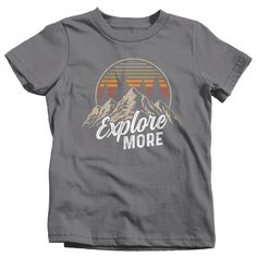 "Kids Hiking T Shirt Hiker Shirt Explore More Mountains Shirt Hiker Gift Camping Tee Mountains Shirt Boy's Girl's Youth Get there when you do! Hiking can be so freeing. This t shirt is perfect for any hiker or camper. It features vintage colors, a mountain range and distressed fonts. It simply reads 'Explore More'. Made of soft, ring spun cotton. Includes a drawstring cotton gift bag. Direct to garment printed using the latest technology. Soft, ring spun cotton. Please check out my other Etsy It Hiking T Shirt, Mountains Shirt, Kids Hiking, Distressed Font, Junior Shirts, Camping Tee, Hiker Gifts, Hiking Tshirt, Mountain Shirt