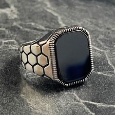 Mens Square Black Onyx Stone Silver Ring , Silver Natural Dark Black Gemstone Ring , 925K Sterling Silver Ring , Honeycomb Patterned Ring , Gift For Him , Same Day For Shipping ✧ Product Details * Handmade İtem * Gender : Male / Female * Material : 925K Sterling Silver * Ring Weight : 8.5 Grams * Gemstone Type : Black Onyx ✔ Usage Details * Silver jewelry is very sensitive to chemicals. It is recommended to keep away from chemical substances such as cream, bleach, deodorant, detergent. * Silver jewelry can also darken quickly in salt water, that is, in sea water. For this reason, it is best to remove them when swimming in the sea. ✔ Shipping * Your orders placed on weekdays are delivered to the cargo on the same day. Your orders placed on the weekend are delivered to the cargo on Monday. ✔ Luxury Black Sterling Silver Ring, Black Sterling Silver Signet Ring 925 Stamped, Black Sterling Silver Signet Ring Stamped 925, Black Enamel Sterling Silver Signet Ring, Luxury Black Signet Ring Stamped 925, Black Gemstone Ring, Chemical Substances, Pattern Ring, Black Onyx Stone