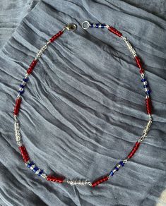 Cute & stylish patriotic handmade beaded eye pin necklace & bracelet! - Nickel-Free - Clasp, eye pin, & chain options: Sterling Silver, 18k Gold Plated, & Silver Plated - Available as a set or individually PLEASE NOTE: When ordering the Set of 2 (Necklace & Bracelet) be sure to specify which sizes for both in the PERSONALIZATION section. Every piece is handmade and made to order! Please allow 1-2 weeks to receive your order, though it may be sooner! Note: The clasp & ring pictured is slightly larger than what will be on the final product. CARE INSTRUCTIONS:  - I do my best to ensure that each piece of jewelry is secure and durable. In the rare occasion that a jump ring or eye pin deatches, these can be fixed using pliers. - Glass beads are coated and not color fast. To prevent fading, take Patriotic Adjustable Colorful Beads Jewelry, Adjustable Colorful Beaded Jewelry For 4th Of July, Adjustable Patriotic Jewelry With Colorful Beads, Patriotic Jewelry With Colorful Beads As Gift, Patriotic Blue Jewelry With Colorful Beads, Patriotic Colorful Beaded Jewelry Gift, Silver Jewelry For 4th Of July Gift, Silver Jewelry Gift For 4th Of July, Patriotic Round Beads Necklace As Gift