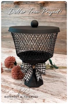 an old fashioned wire basket with flowers on it and the words dollar tree project above it