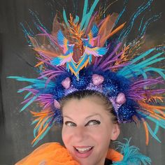 Beautiful Phoenix Fire Mardi Gras headdress could be a great addition to your fun party outfit... Decorated with sparkly blue, orange twigs, sparkly blue balls, pink hearts, colorful mesh, tulle, sequin, ..in the middle two Azure blue, Pink, Gold embroidered Phoenix birds. Blue back side.  Light weight, elastic in the back, fits most heads. Colors might look sliightly different from pictures due to your screen setting. All crowns hand made. Shipped by USPS next business day! NO refunds, NO returns, but please let me know if something wrong with your item.  Check my shop for other Holiday crowns and matching face mask. Contact me for special orders. Thank you for your interest in my design. Have fun, stay safe. Carnival Crown Headpiece For Mardi Gras, Crown Headpiece For Mardi Gras Carnival, Mardi Gras Carnival Crown Headpiece, Carnival Festival Headpiece With Structured Crown, Bohemian Crown Headpiece For Carnival, Festival Headpiece With Structured Crown Design, Adjustable Tall Crown For Festival, Adjustable Tall Crown For Festivals, Adjustable Structured Crown For Festival