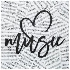 music sheet with the word music written in black and white ink on it, surrounded by musical