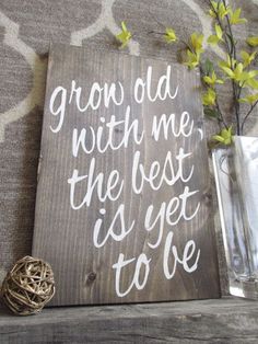 a wooden sign that says grow old with me, the best is yet to be