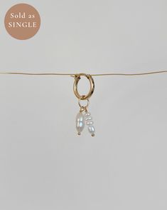 Sold as a single earring, not as a pair ✿ Material: 0.12-0.20 inch High-Quality Freshwater Pearls and 0.29-0.31 inch Baroque Freshwater Pearl ✿ Finish: 14K US Gold-Filled Hoop 15mm ✿ Approx. 1.25 inches in length and 0.6 inch in width ✿ Tarnish resistant, hypoallergenic, safe for sensitive skin Minimalist White Dangle Huggie Earrings, White Dangle Single Cartilage Earring, Huggie Hoop Earrings, Single Earring, Gold Hoop Earrings, Sensitive Skin, Fresh Water, Freshwater Pearls, Gold Filled