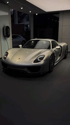 a silver sports car parked in a garage