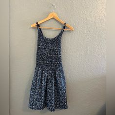 Nwt Free People | Petunia Cotton Mini Dress In Blue Floral Smocked Overall Style, Size S So Sweet In An Apron-Style Silhouette, This Essential Mini Dress Features A Textured Top Piecing With Cross-Straps At Back For Added Dimension. Beautiful Blue Cottage Core Vibes With Little White Flower Print. Features: Button Closure At Straps Side Pockets Scoop Neckline Care/Import Machine Wash Cold Inside Out 100% Cotton Measurements For Size Small Bust: 30 In Length: 30.5 In Size: Women's Small Color: Bl Casual Cotton Dress With Smocked Back, Casual Smocked Ruched Stretch Dress, Casual Stretch Smocked Dress With Ruched Detail, Casual Stretch Smocked Ruched Dress, Casual Ruched Smocked Stretch Dress, Casual Stretch Smock Dress, Casual Smocked Stretch Dress, Casual Cotton Smocked Dress With Ruched Detail, Casual Cotton Smocked Ruched Dress