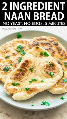 two naan breads on a plate with the title overlay reading 2 ingredient naan bread no yeast, no eggs, 5 minutes