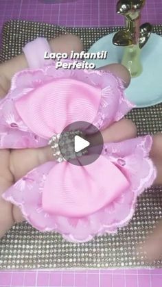 a video demonstrating how to make fabric flower hair clips for babys and toddlers