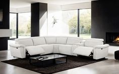 a modern living room with black and white furniture