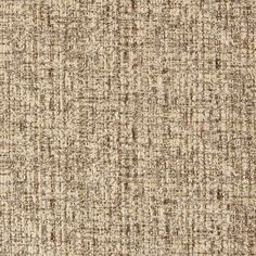 an upholstered beige and brown textured fabric