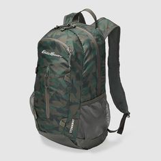 the back pack is camouflage print and has mesh pocket for compartments to keep things organized