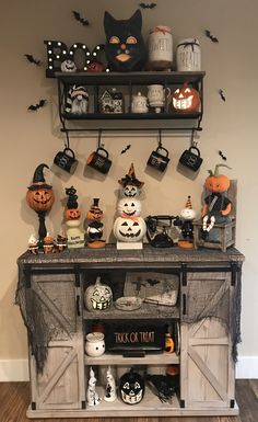 a halloween display with pumpkins and other decorations