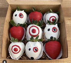 a box filled with chocolate covered strawberries in the shape of animals