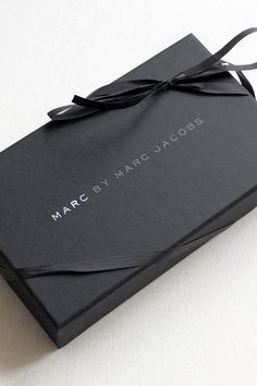 a black box with a ribbon tied around it